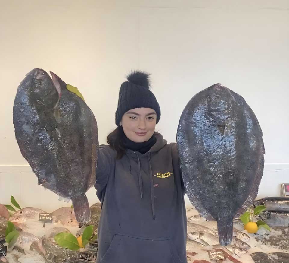girl holding two fish
